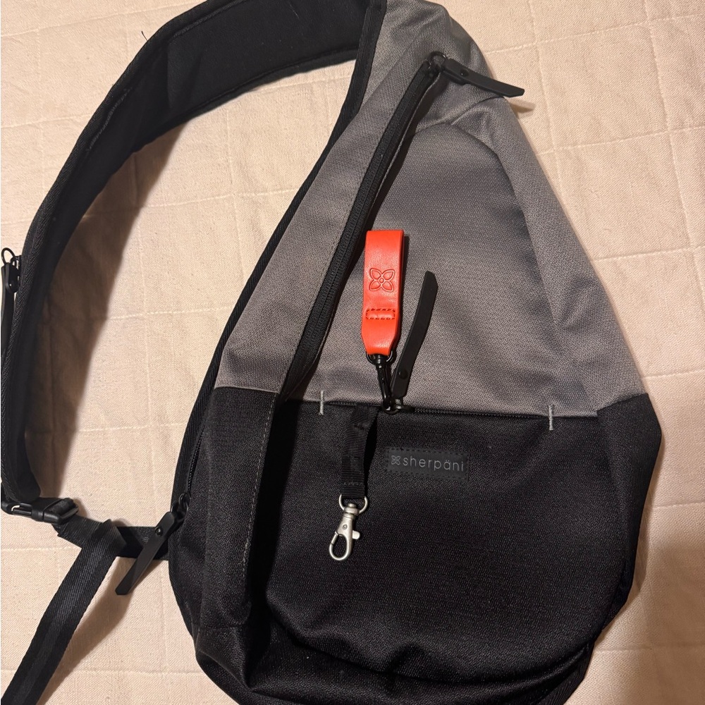 Sherpani Black and Green Woman’s Crossbody Bag/Backpack